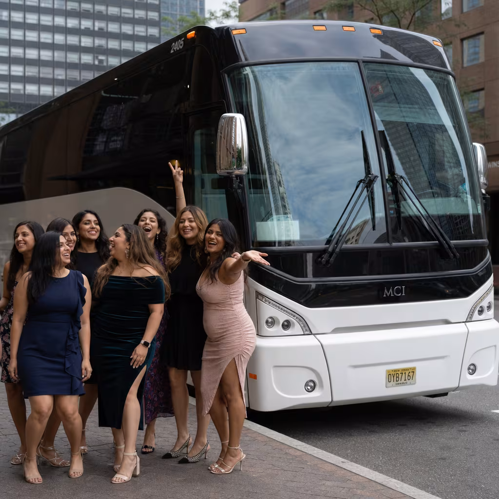 Passengers loading luggage while boarding an Jersey City group shuttle