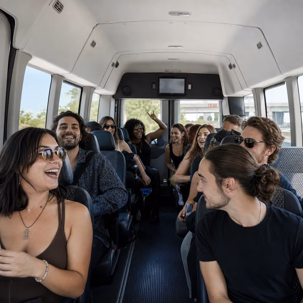 Party bus interior with wraparound leather seating and LED lighting in Jersey City