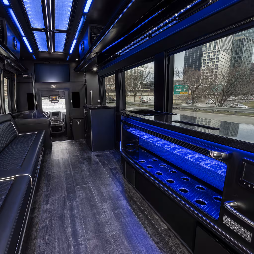 Party bus interior with wraparound leather seating and LED lighting in Jersey City