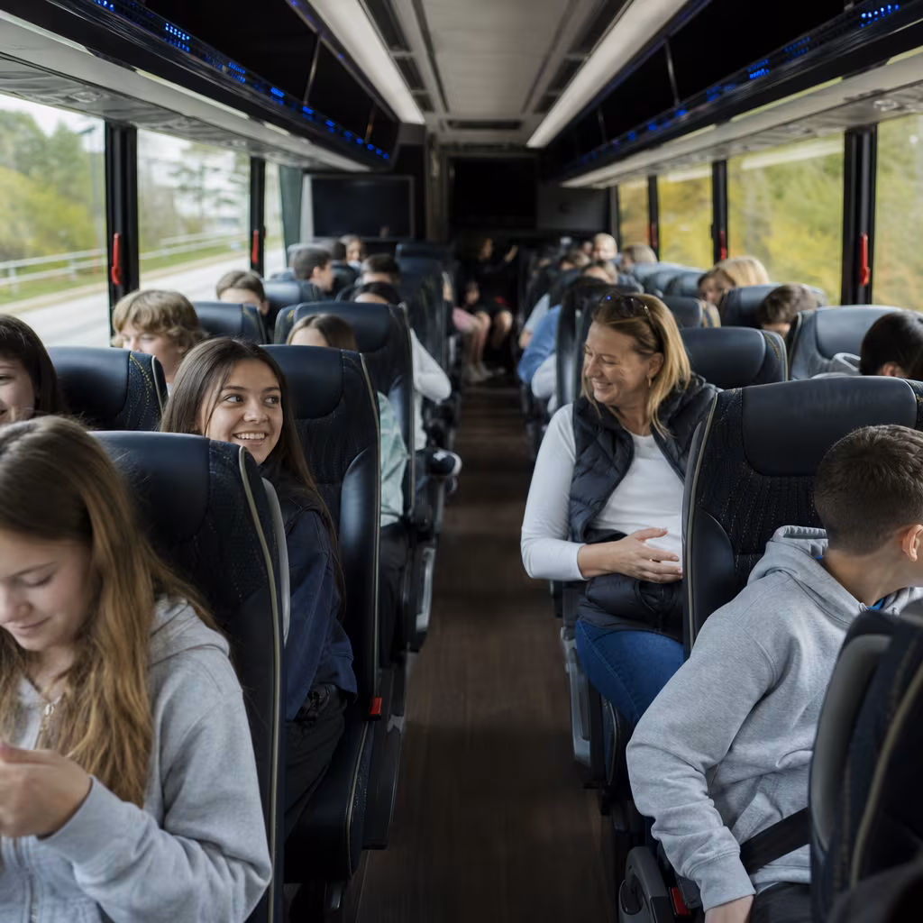 Group boarding a white charter bus for School Transportation transportation in Jersey City