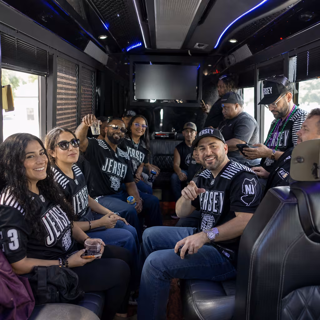 Group boarding a white charter bus for Sporting Event Transportation transportation in Jersey City